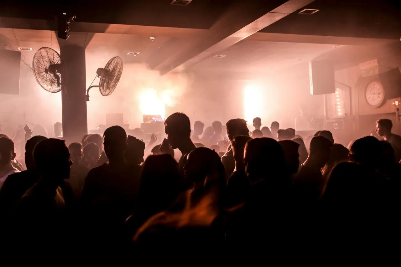 Nightclub entrance with queue line and doorman at Canadian hospitality venue
