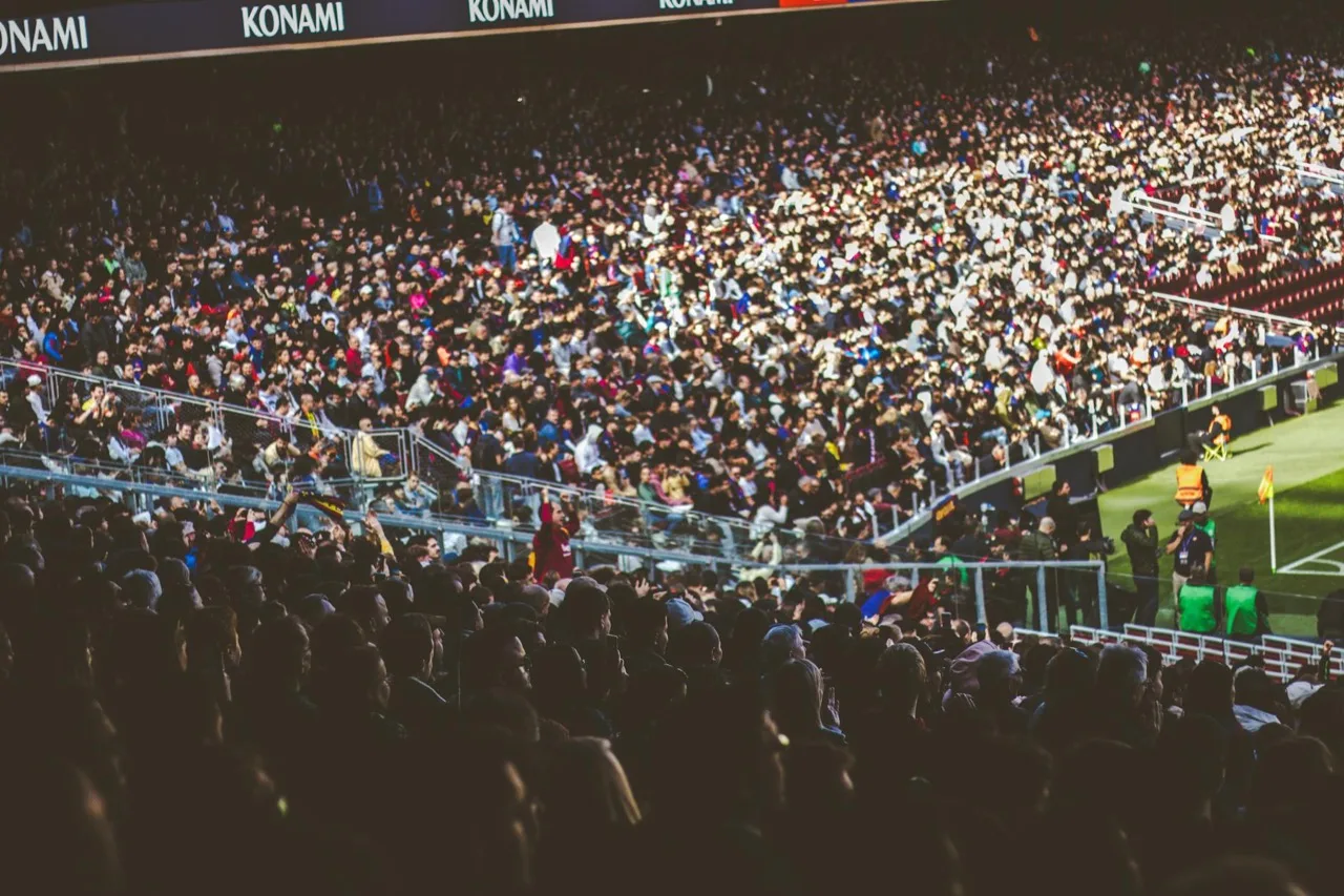 Packed sports stadium with fans cheering during game event in Canada